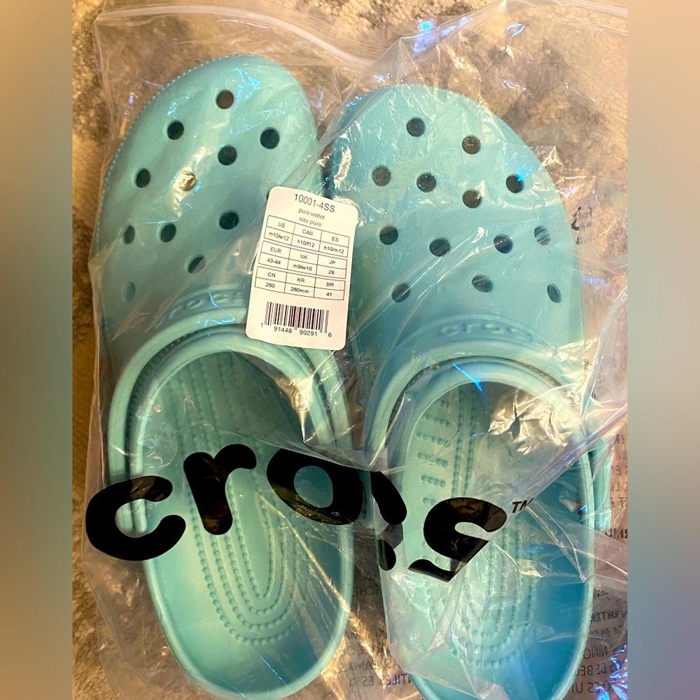Crocs, mens 10 or women's 12, color is pure water, brand new with tags